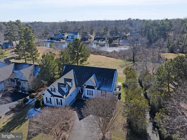 an aerial view of a house with a yard sitting space