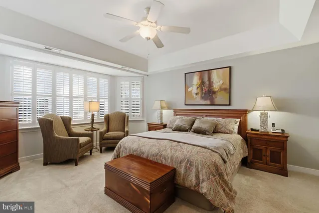 a spacious bedroom with a bed and a couch