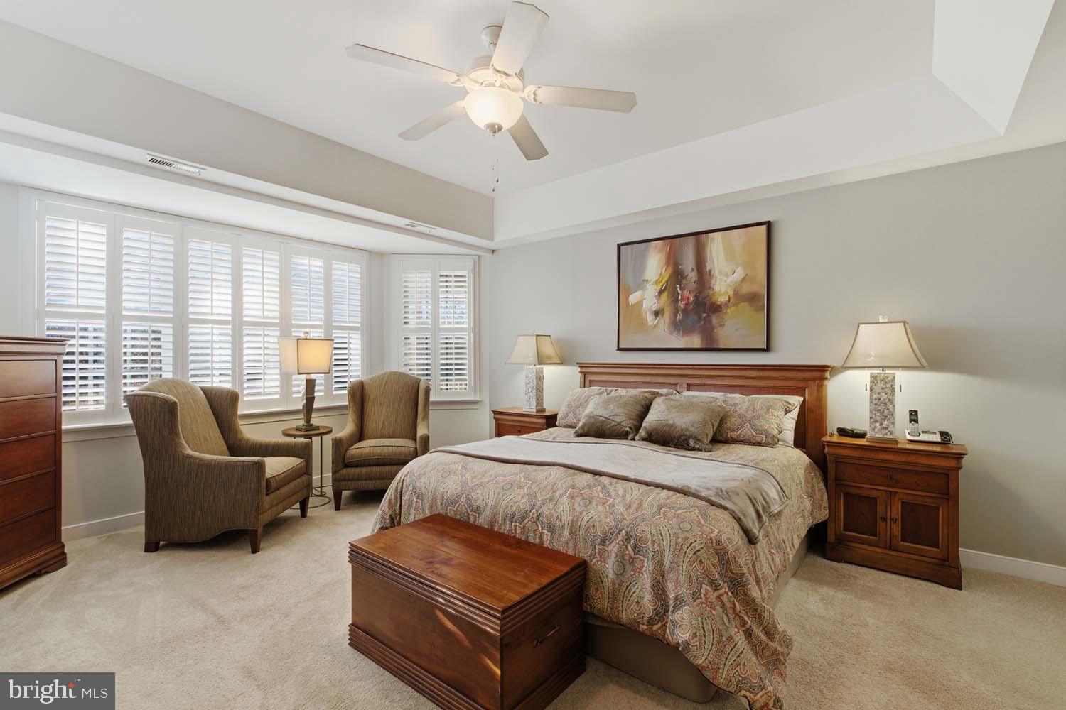 464 Middle Gate Irvington, VA 22480 - Photo 21 of 46 a spacious bedroom with a bed and a couch