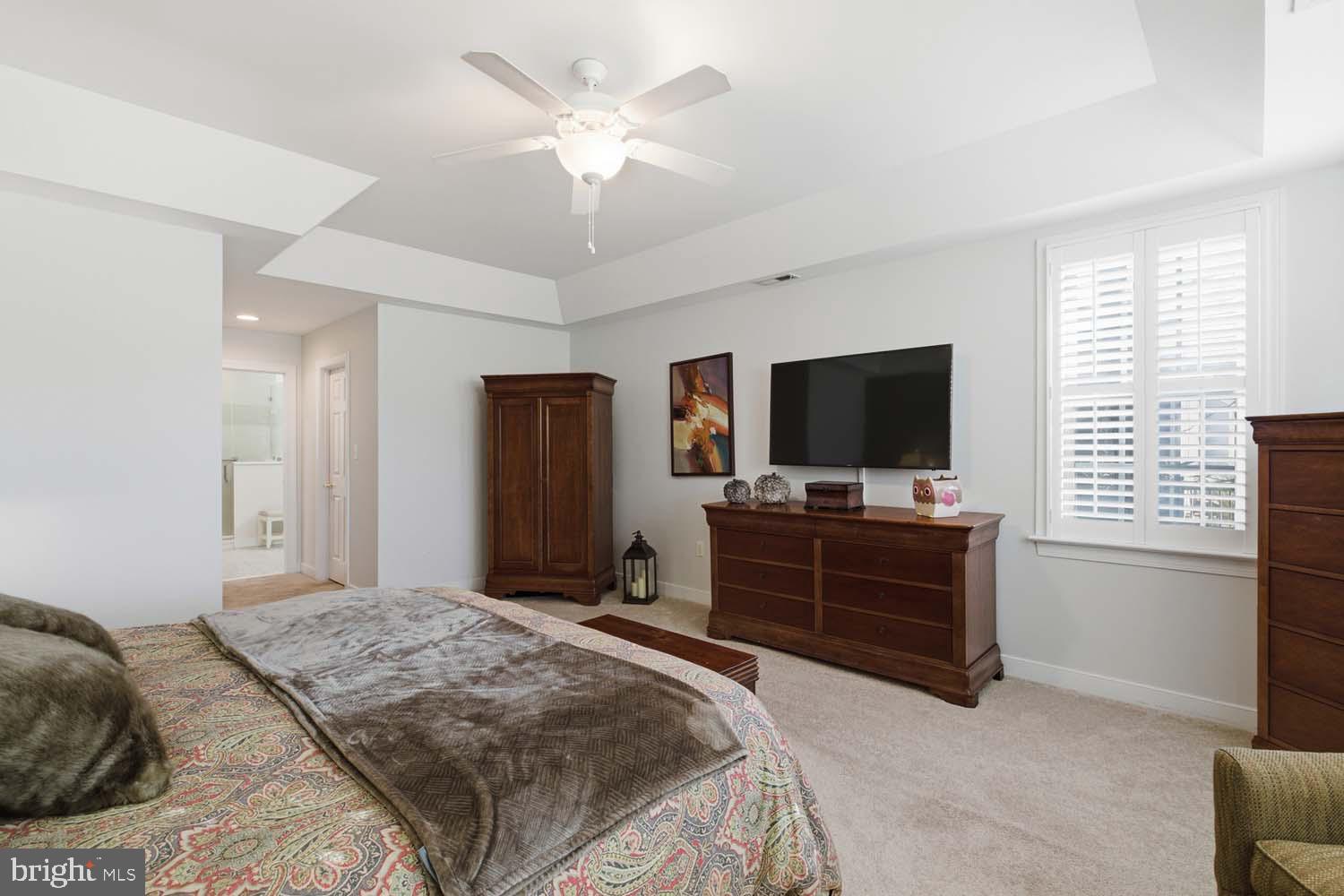 464 Middle Gate Irvington, VA 22480 - Photo 23 of 46 a bedroom with a bed and a flat screen tv