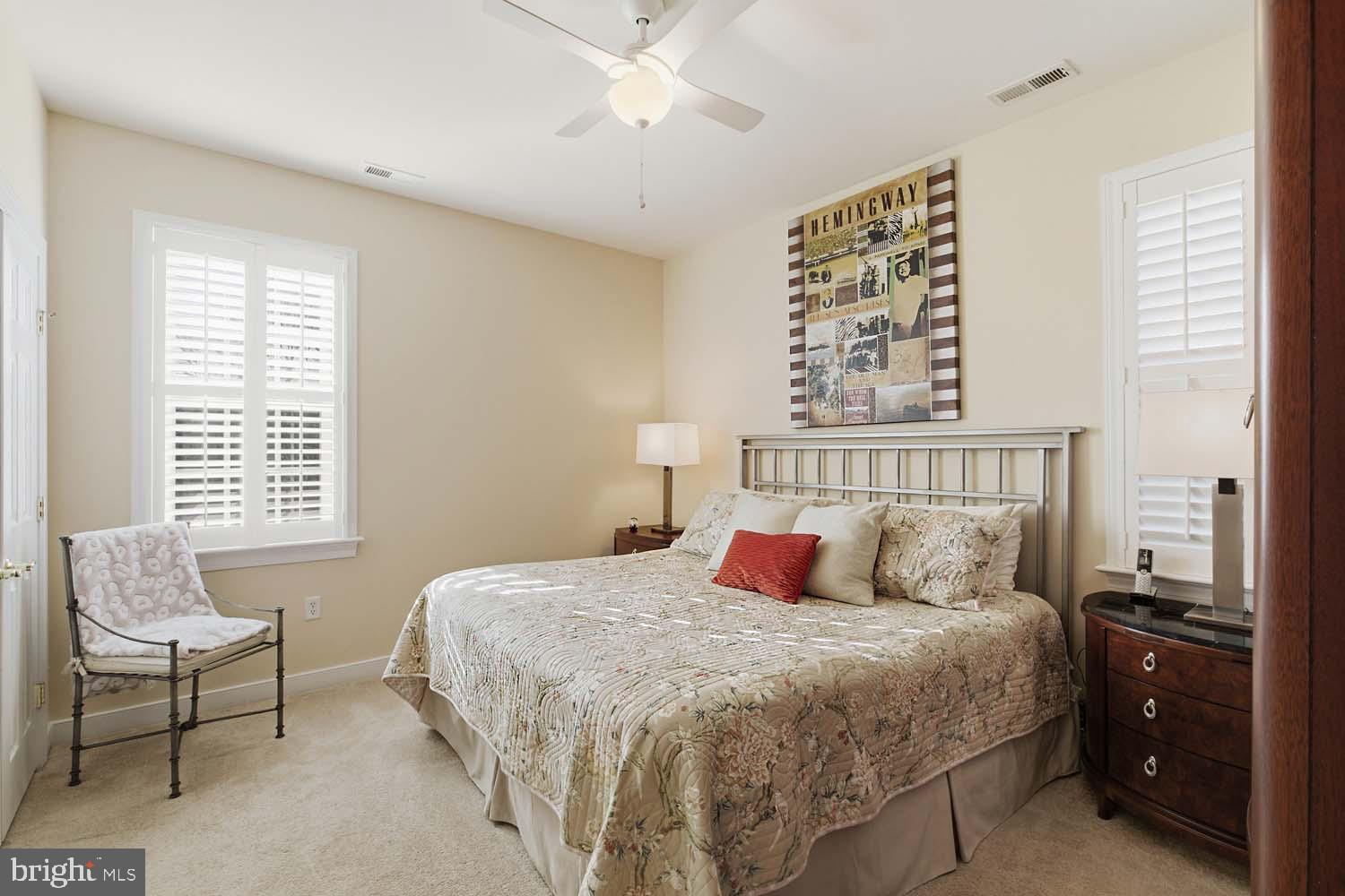 464 Middle Gate Irvington, VA 22480 - Photo 28 of 46 a bedroom with a bed and wooden floor