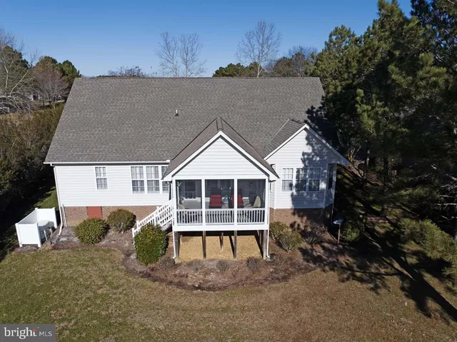 a house with trees in the background