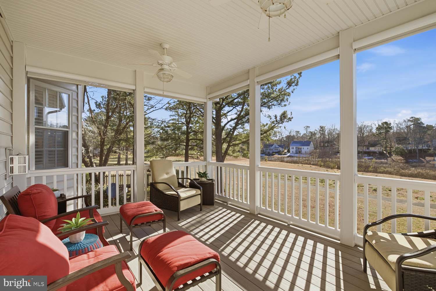 464 Middle Gate Irvington, VA 22480 - Photo 34 of 46 a living room with furniture a large window and wooden floor