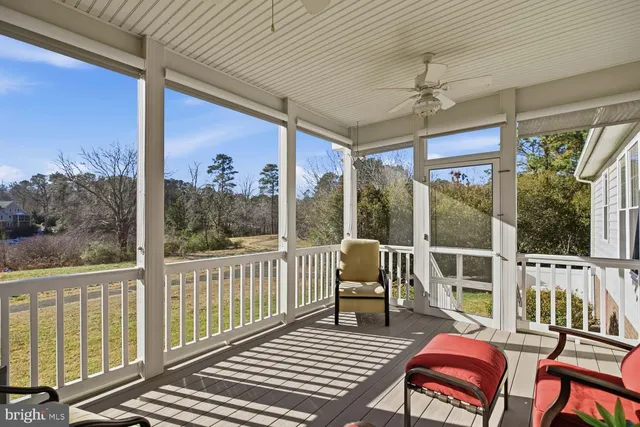 a view of a balcony with furniture