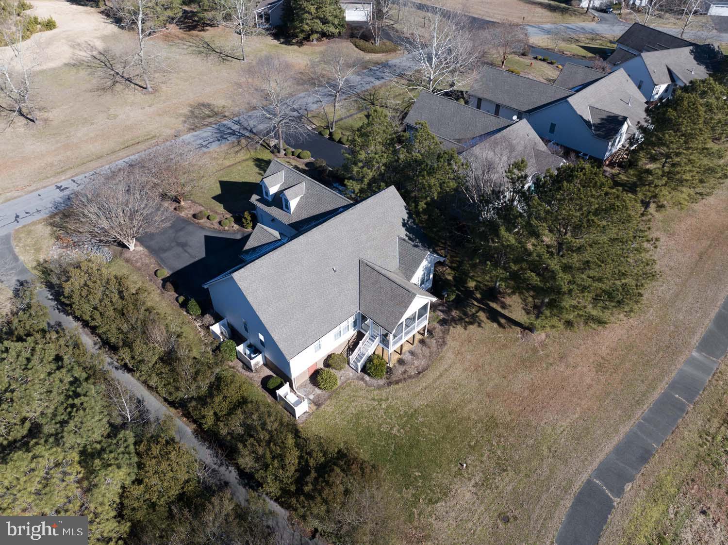 464 Middle Gate Irvington, VA 22480 - Photo 39 of 46 an aerial view of multiple houses with yard