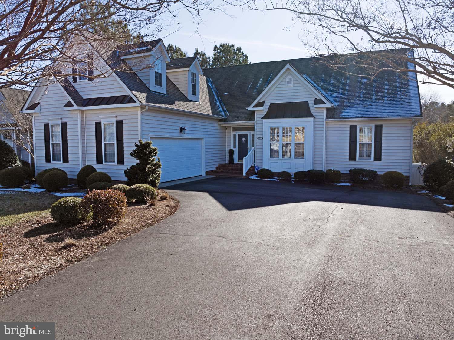 464 Middle Gate Irvington, VA 22480 - Photo 4 of 46 a front view of a house with a yard outdoor seating and utility room