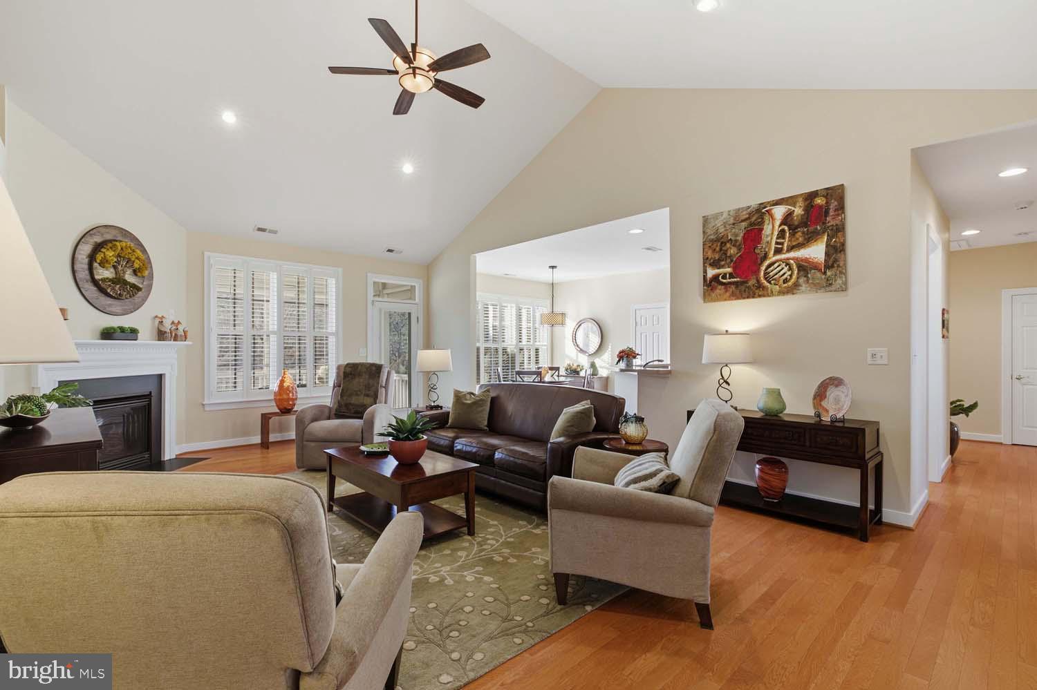 464 Middle Gate Irvington, VA 22480 - Photo 10 of 46 a living room with furniture a fireplace and a window