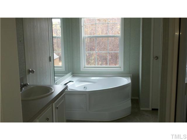 1474 Semora Road Roxboro, NC 27574 - Photo 8 of 9 Master bath has garden tub, sep shower and dual vanaties.