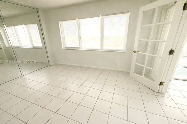 a view of an empty room and window