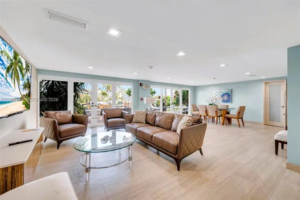 a living room with furniture and a table
