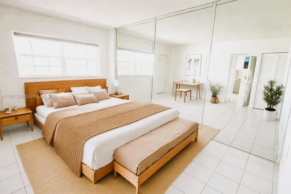 a bedroom with bed and a table