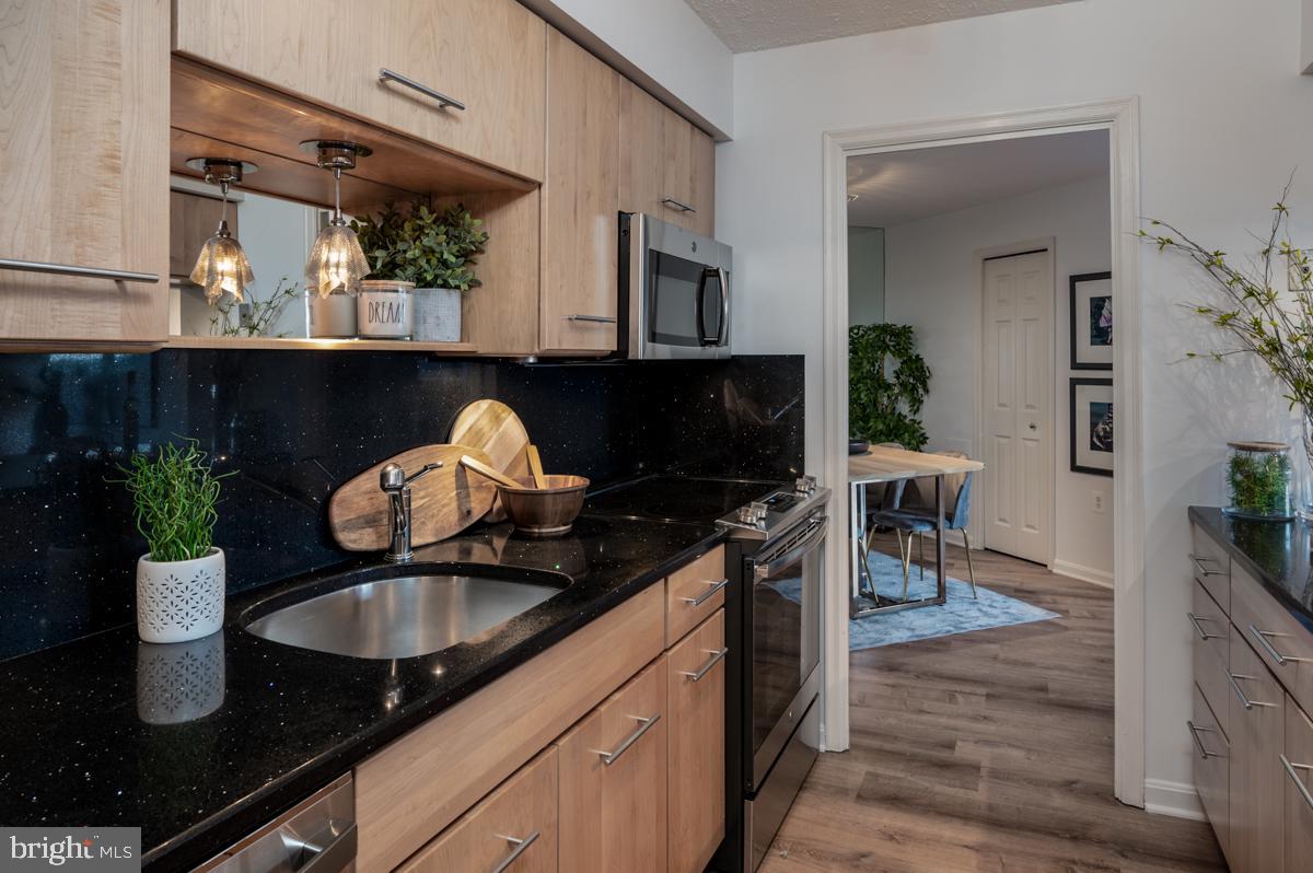 1301 North Courthouse Road, Unit 1106 Arlington, VA 22201 - Photo 11 of 48 Sleek and modern kitchen with new appliances