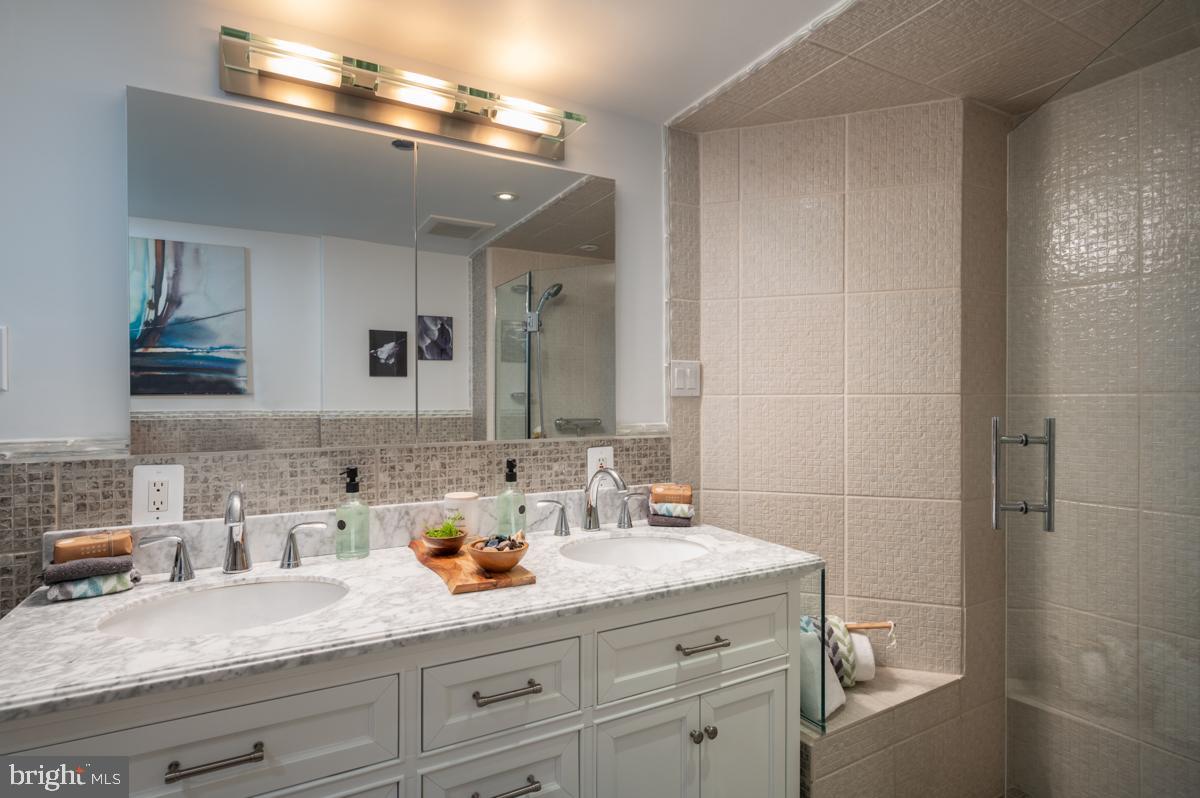 1301 North Courthouse Road, Unit 1106 Arlington, VA 22201 - Photo 25 of 48 En-suite bathroom with dual vanity and modern tile