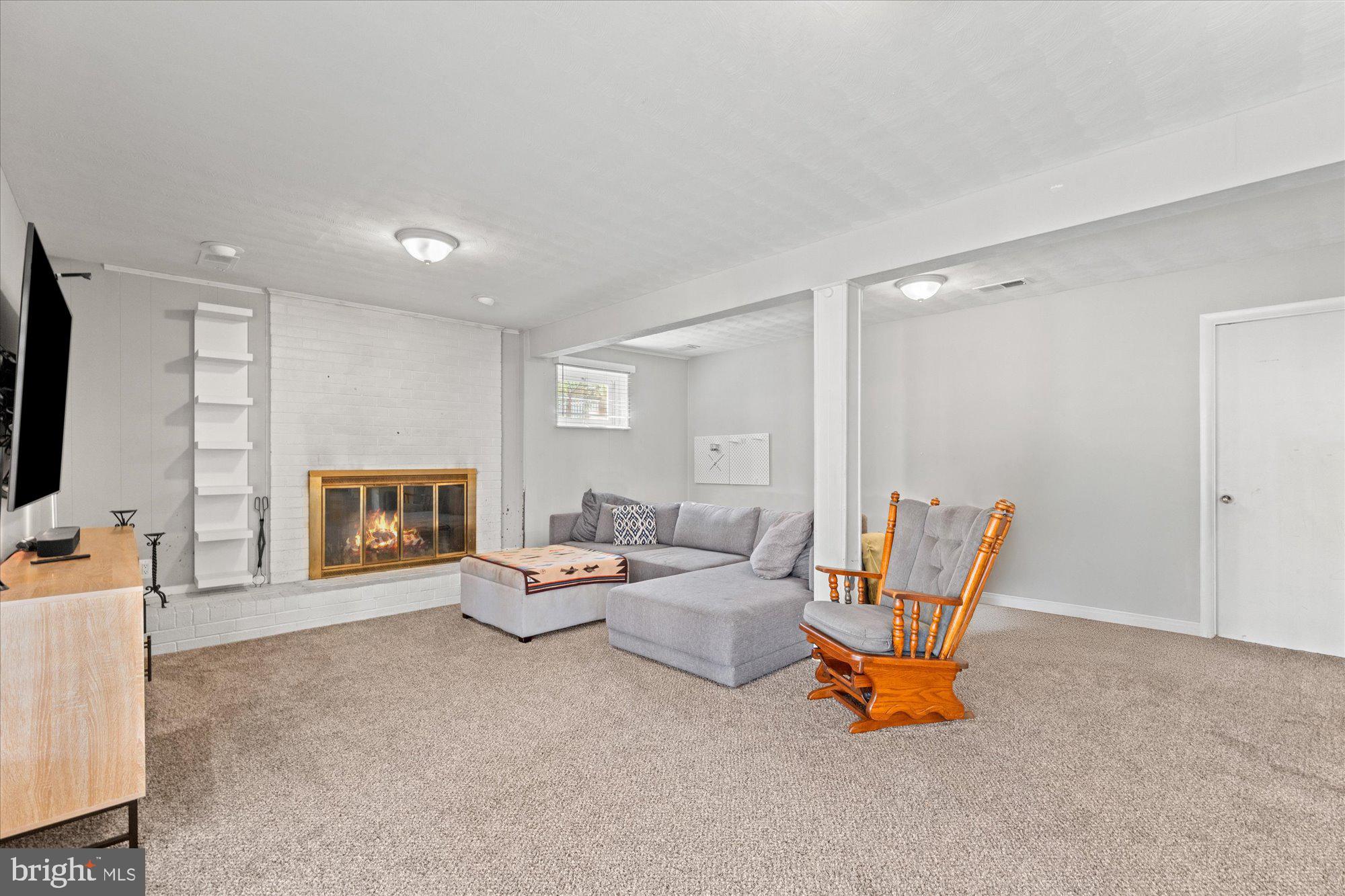 13501 Collingwood Terrace Silver Spring, MD 20904 - Photo 20 of 30 Den with fireplace and built-ins on lower level