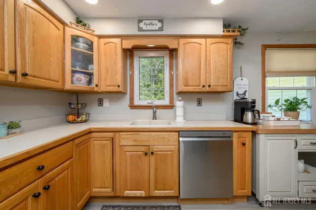 a kitchen with stainless steel appliances granite countertop a sink and cabinets