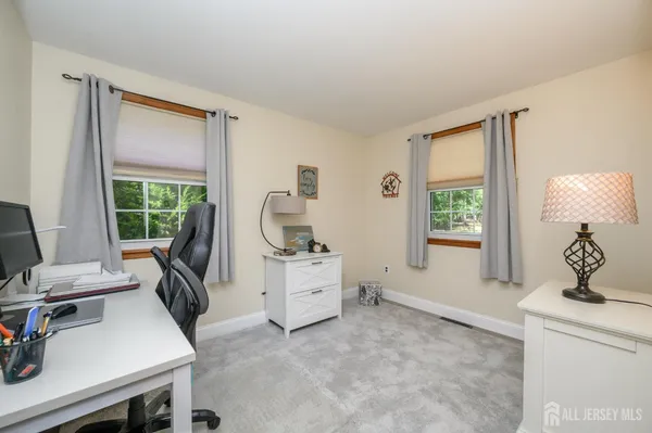 a room with a chair and a window