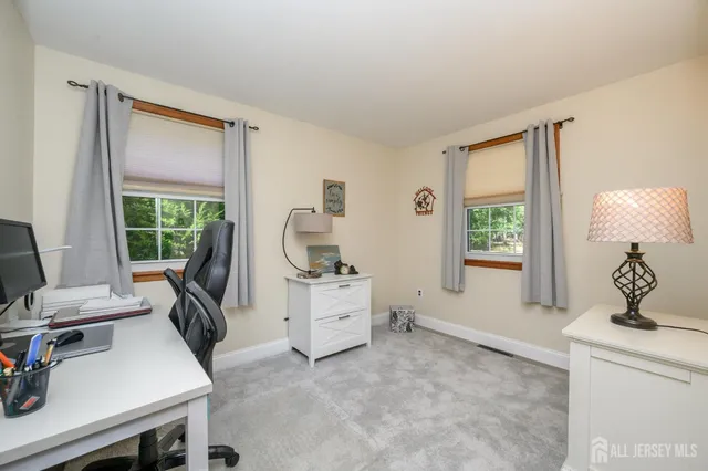 a room with a chair and a window