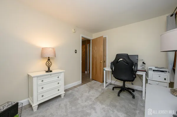 a view of a workspace with furniture