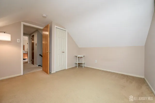 an empty room with closet area