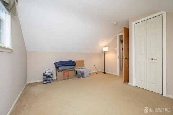 a view of a storage & utility room with closet windows