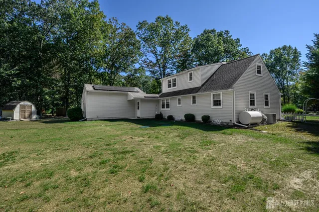 a view of a house with a back yard