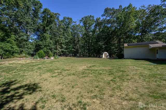 a view of outdoor space with deck and yard