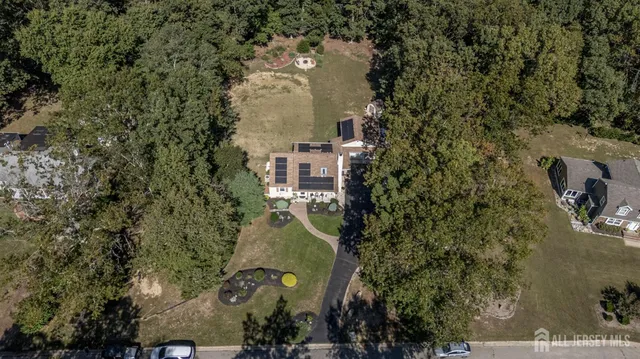 an aerial view of a house with outdoor space