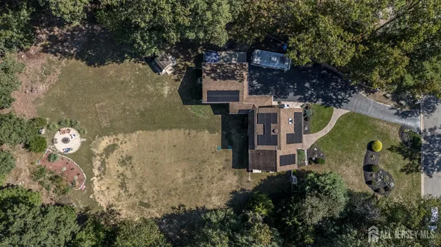 an aerial view of a house with outdoor space