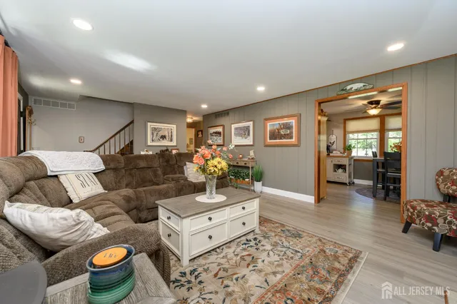 a living room with furniture and a table