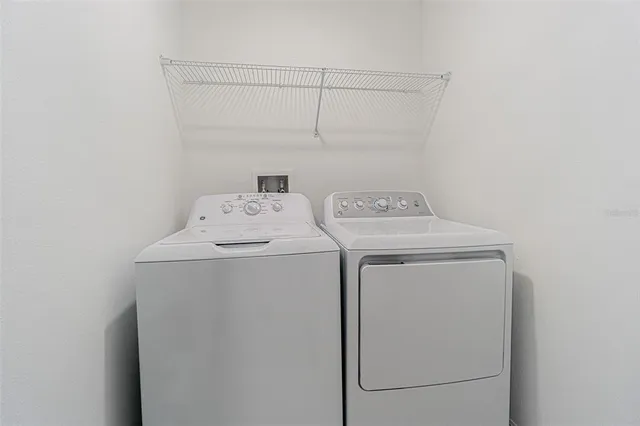 an empty room with closet and ceiling fan