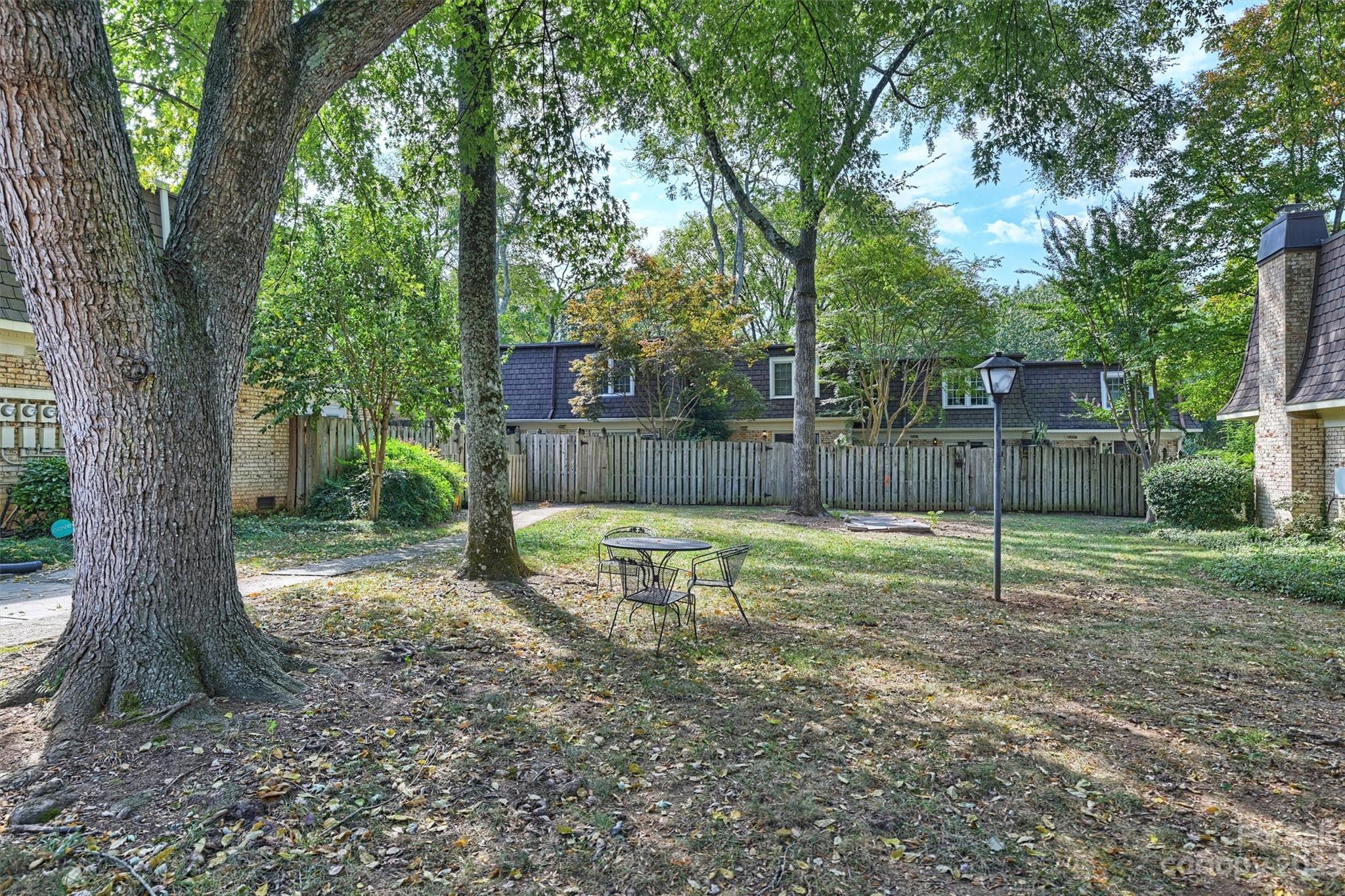 1712 Roxborough Road Charlotte, NC 28211 - Photo 41 of 44 a view of a backyard with large tree