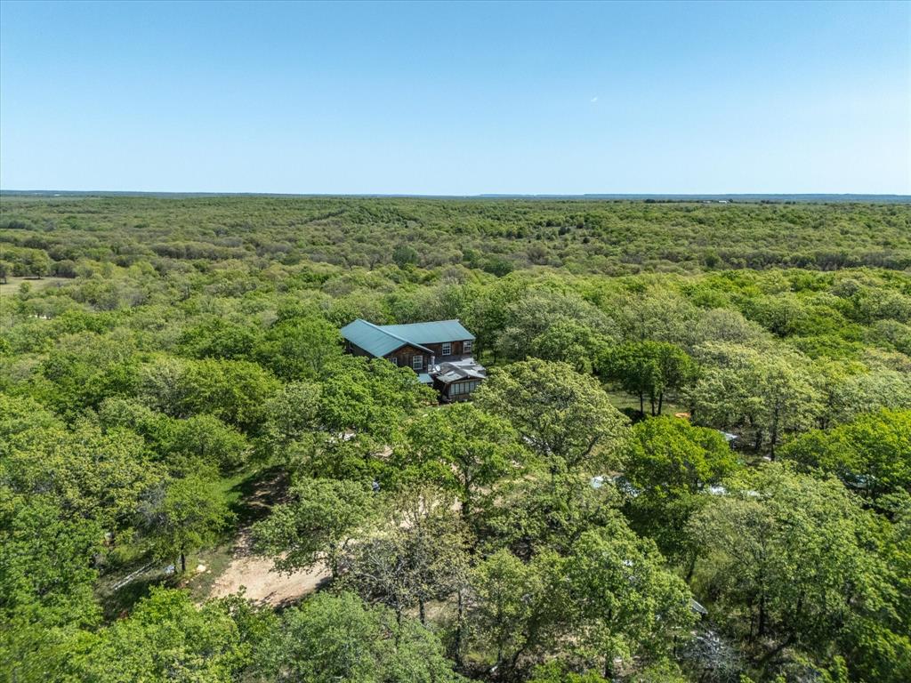 900 Old Spring Road Nocona, TX 76255 - Photo 19 of 27 an aerial view of residential houses with outdoor space