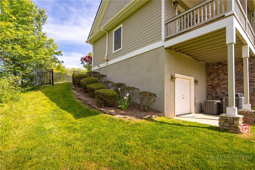 147 Riverside Park Court, Unit G2 Jefferson, NC 28640 - Photo 25 of 44 a view of a backyard with plants and a patio