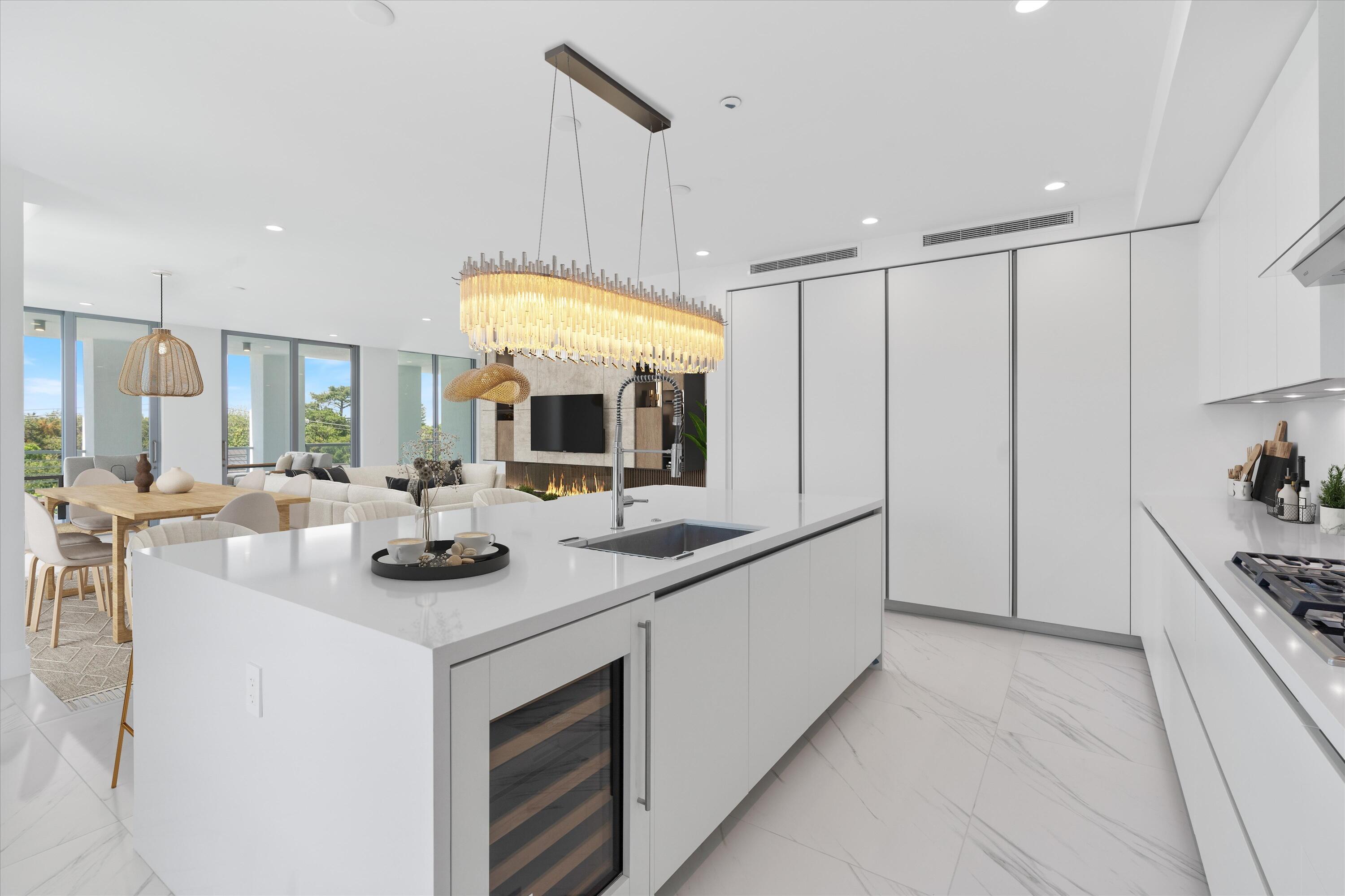 495 East Royal Palm Road, Unit 402 Boca Raton, FL 33432 - Photo 12 of 72 a kitchen with stainless steel appliances granite countertop a sink and a refrigerator