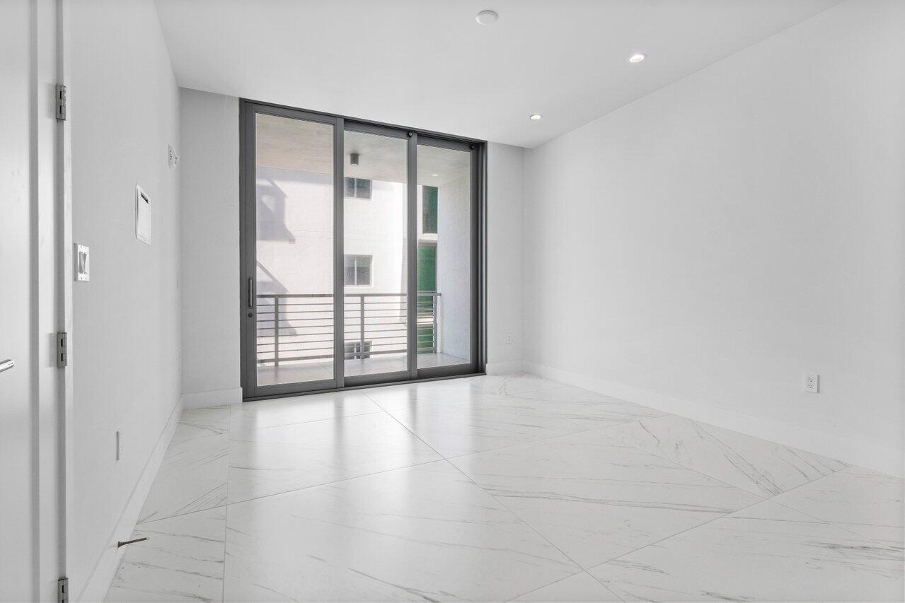 495 East Royal Palm Road, Unit 402 Boca Raton, FL 33432 - Photo 28 of 72 an empty room with windows and closet