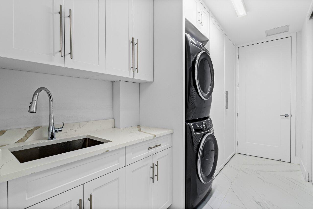 495 East Royal Palm Road, Unit 402 Boca Raton, FL 33432 - Photo 48 of 72 a utility room with sink dryer and washer