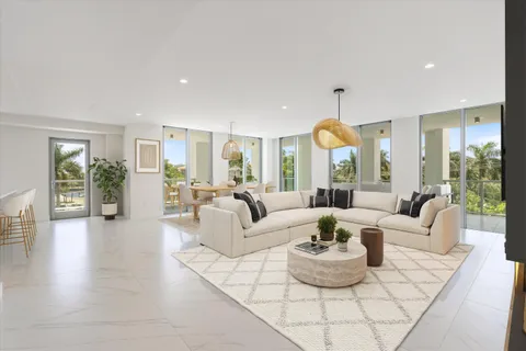 a kitchen with white cabinets and center island