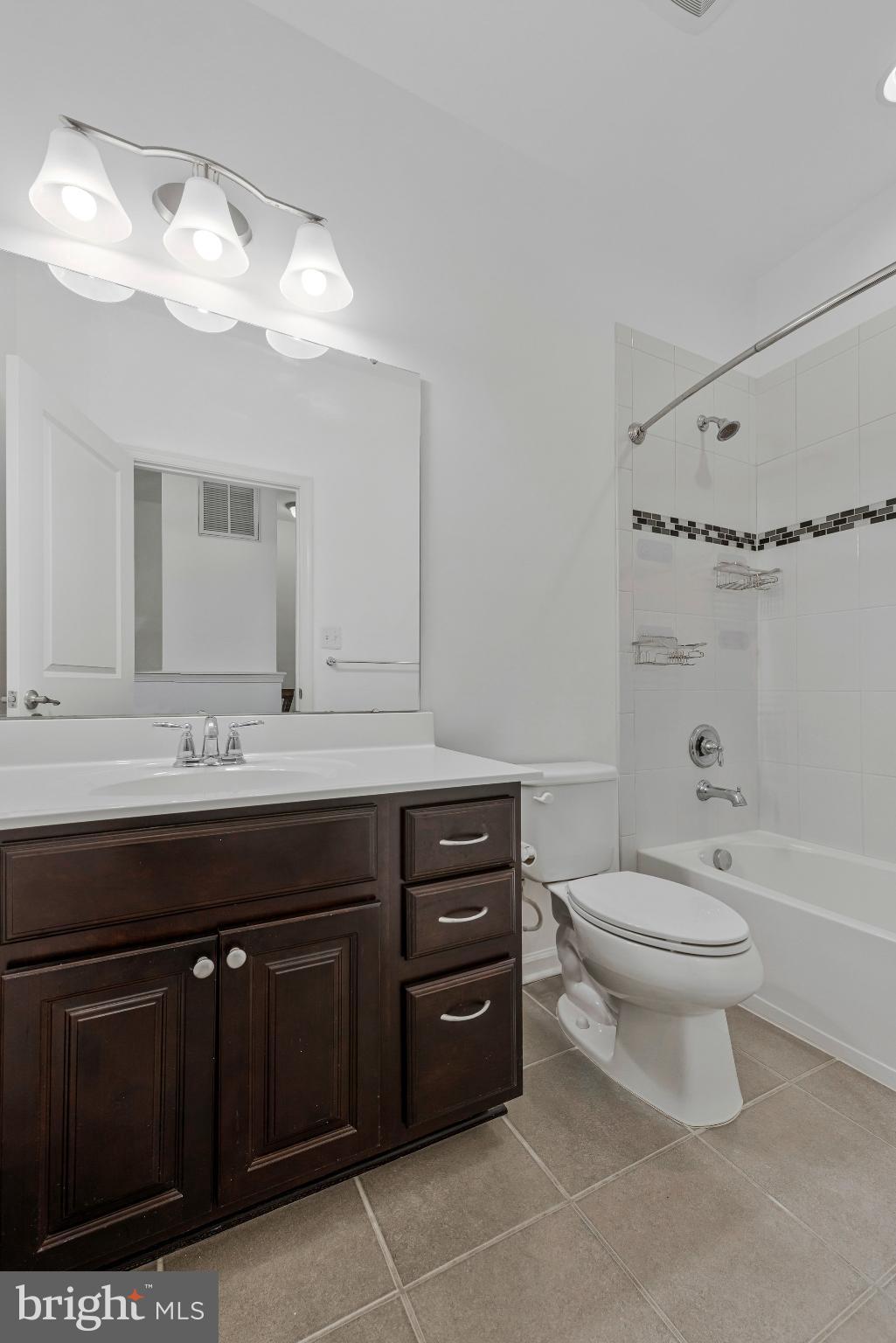 606 Chance Place Capitol Heights, MD 20743 - Photo 25 of 39 a bathroom with a sink a toilet and a mirror