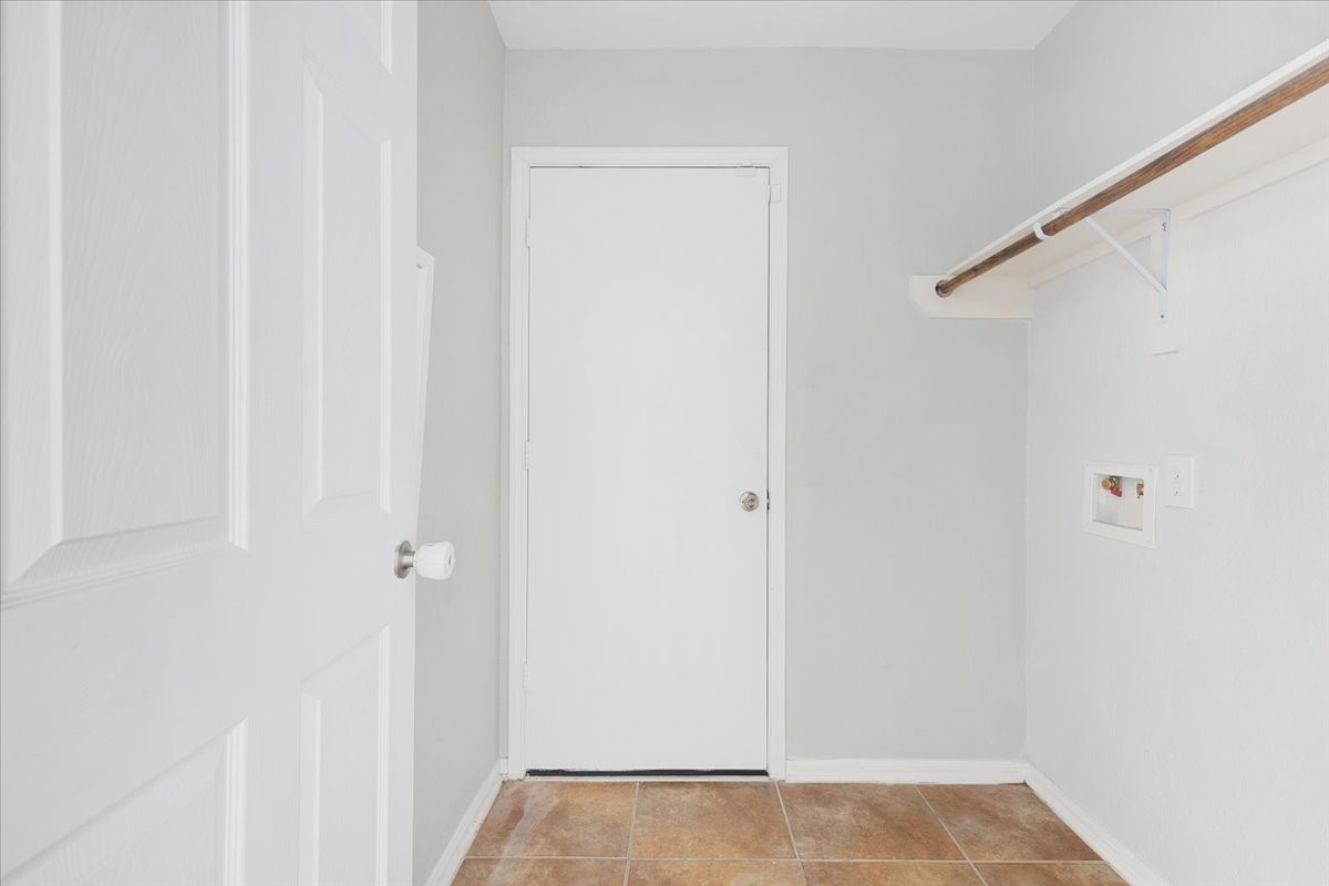 5446 Seabird Street Baytown, TX 77521 - Photo 13 of 23 The washer and dryer room offers a functional and convenient space designed to make everyday laundry tasks easy and efficient.