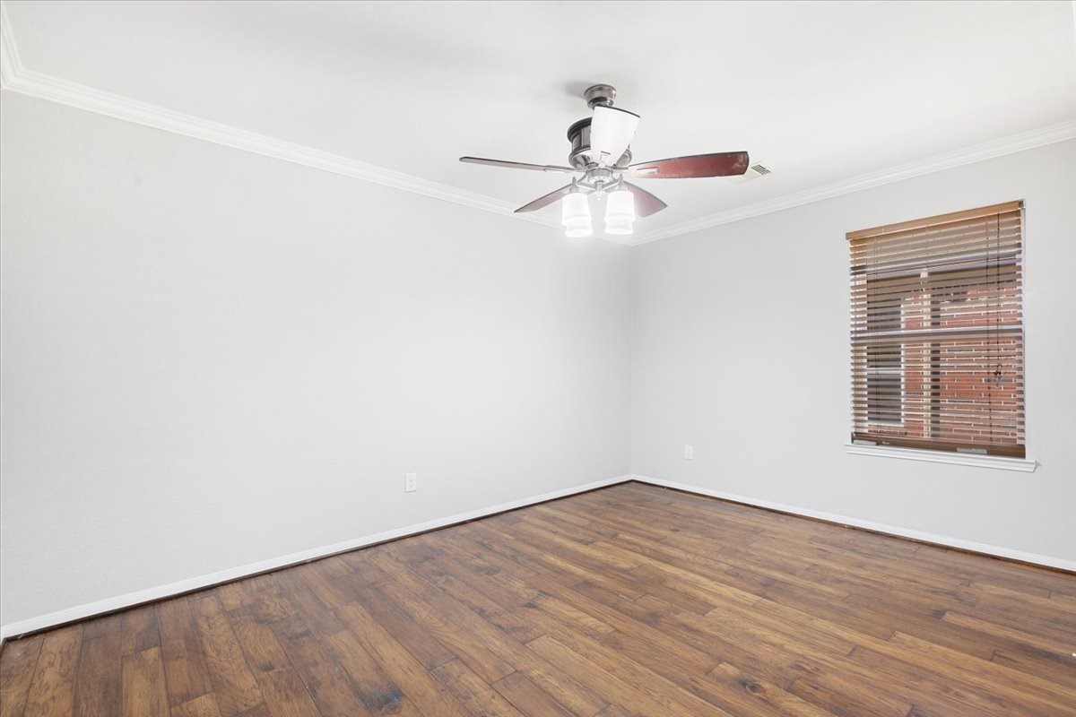 5446 Seabird Street Baytown, TX 77521 - Photo 18 of 23 Another view of bedroom three highlights its generous layout and versatility, making it easy to personalize to your needs.