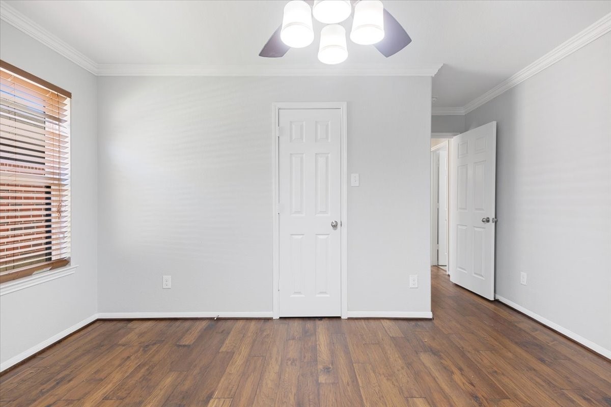 5446 Seabird Street Baytown, TX 77521 - Photo 19 of 23 Bedroom four offers a cozy and functional space, ideal for a guest room, home office, or hobby room.