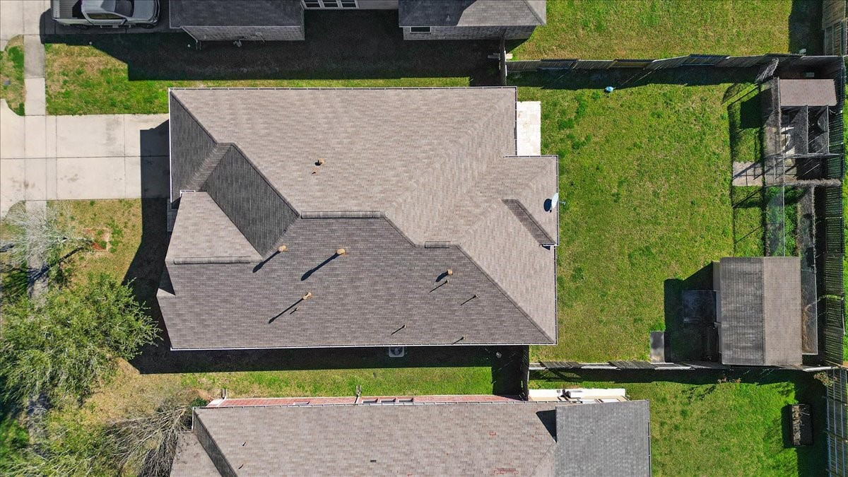 5446 Seabird Street Baytown, TX 77521 - Photo 22 of 23 An aerial view showcases the entire property from above, highlighting the home’s layout, yard, and surrounding landscape.