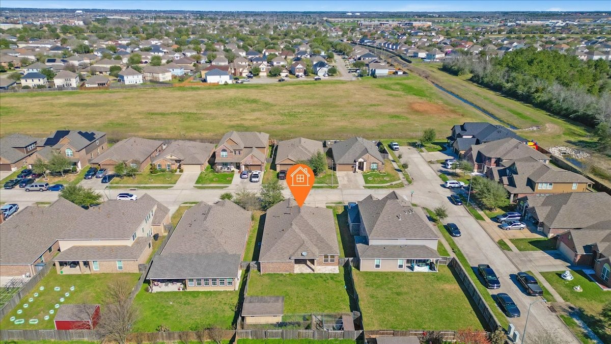 5446 Seabird Street Baytown, TX 77521 - Photo 23 of 23 An aerial view captures the home along with the surrounding neighborhood.