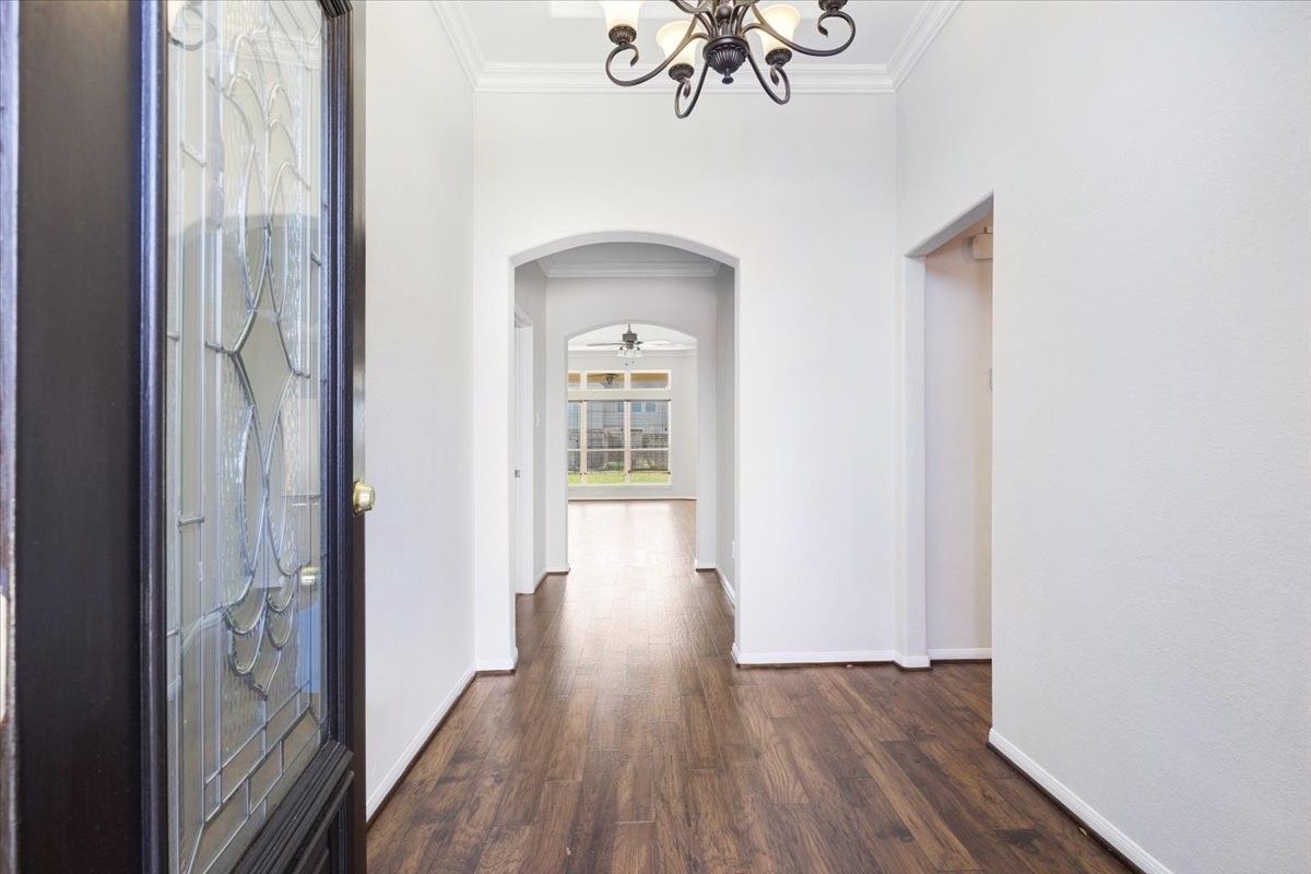 5446 Seabird Street Baytown, TX 77521 - Photo 3 of 23 As you walk in, the foyer welcomes you with an elegant chandelier that adds a warm and inviting first impression.