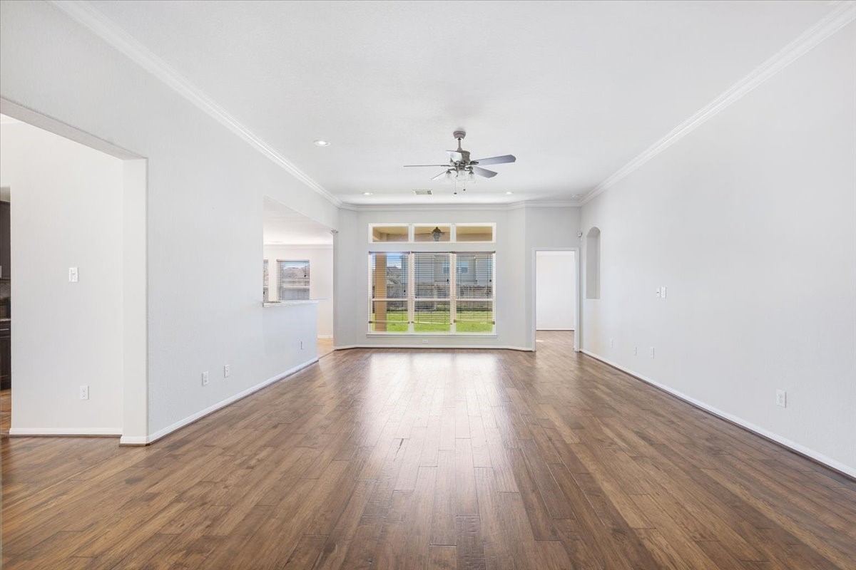 5446 Seabird Street Baytown, TX 77521 - Photo 4 of 23 The spacious living room offers an open, comfortable layout with plenty of room to relax and entertain.