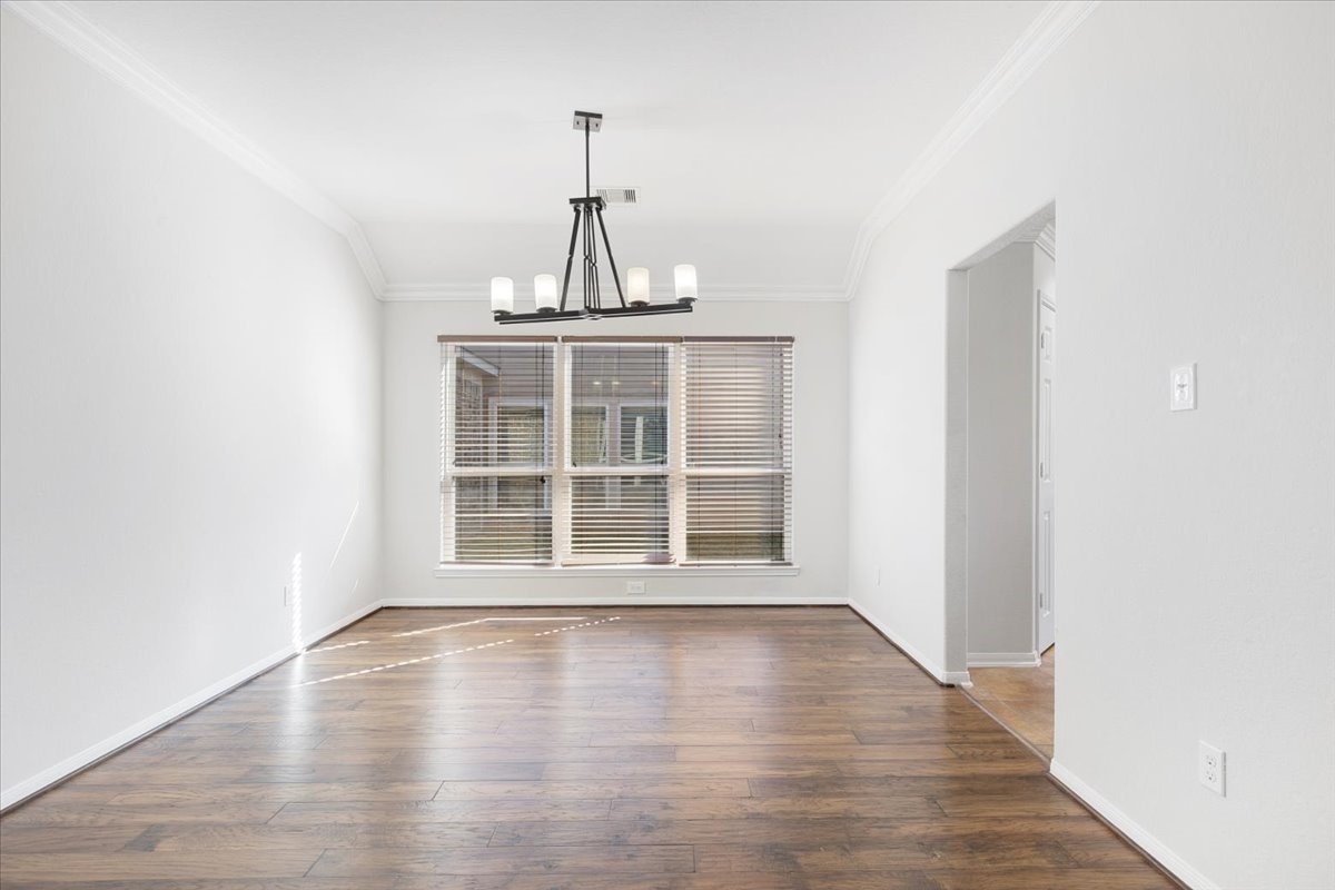 5446 Seabird Street Baytown, TX 77521 - Photo 6 of 23 The dining room features a beautiful chandelier fixture that adds elegance and charm.