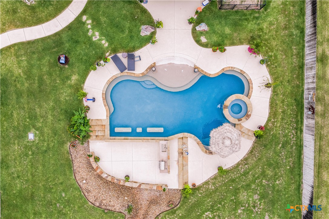 254 Sendera Loop Victoria, TX 77904 - Photo 12 of 48 an aerial view of a house with outdoor space and swimming pool