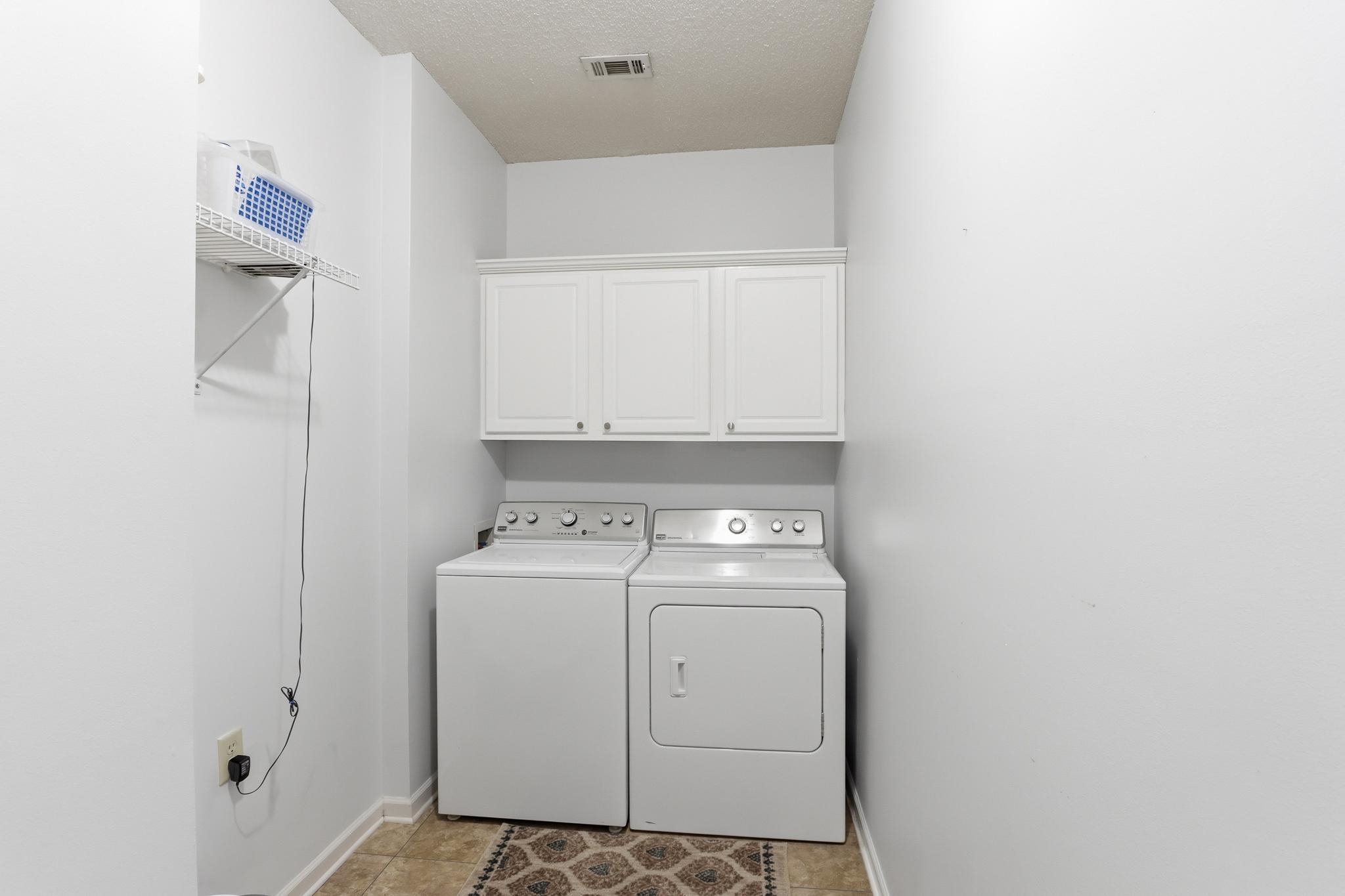 1075 Oak Timber Circle, Unit 69 Collierville, TN 38017 - Photo 23 of 35 a utility room with dryer and washer