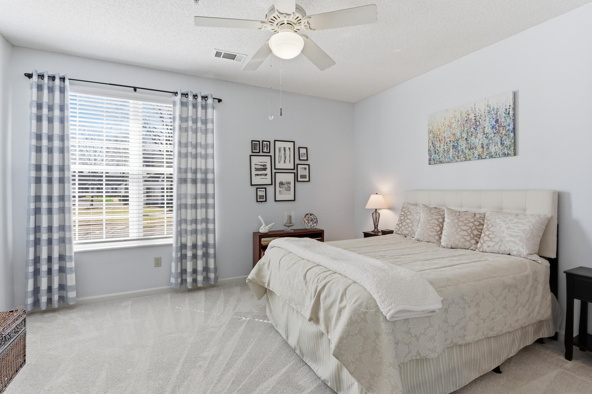 1075 Oak Timber Circle, Unit 69 Collierville, TN 38017 - Photo 24 of 35 a spacious bedroom with a bed and a window