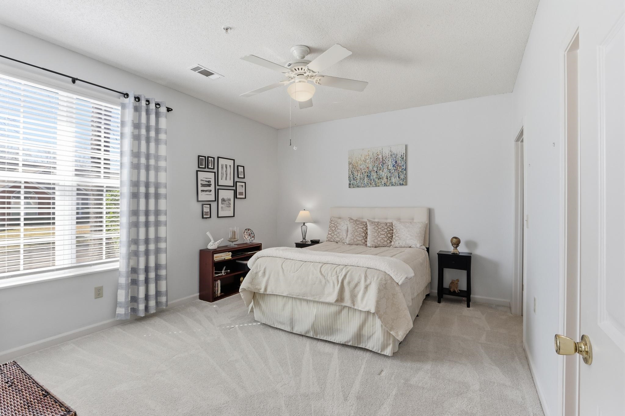1075 Oak Timber Circle, Unit 69 Collierville, TN 38017 - Photo 25 of 35 a spacious bedroom with a bed and a large window